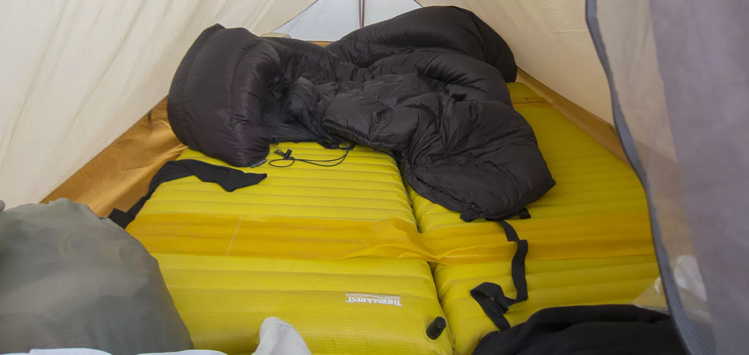 The inside of the Big Agnes Fly Creek UL2 with the Nuntak Dual Arc Alpinist and the Termarest Neoair Xlite. The gray lump in the lower left corner is my pillow.