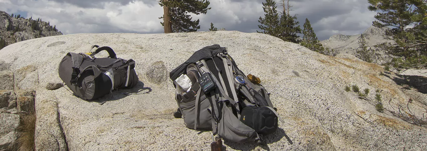 Our packs resting at Granite Lake (on the Two Kings Loop) with the inReach on the strap.