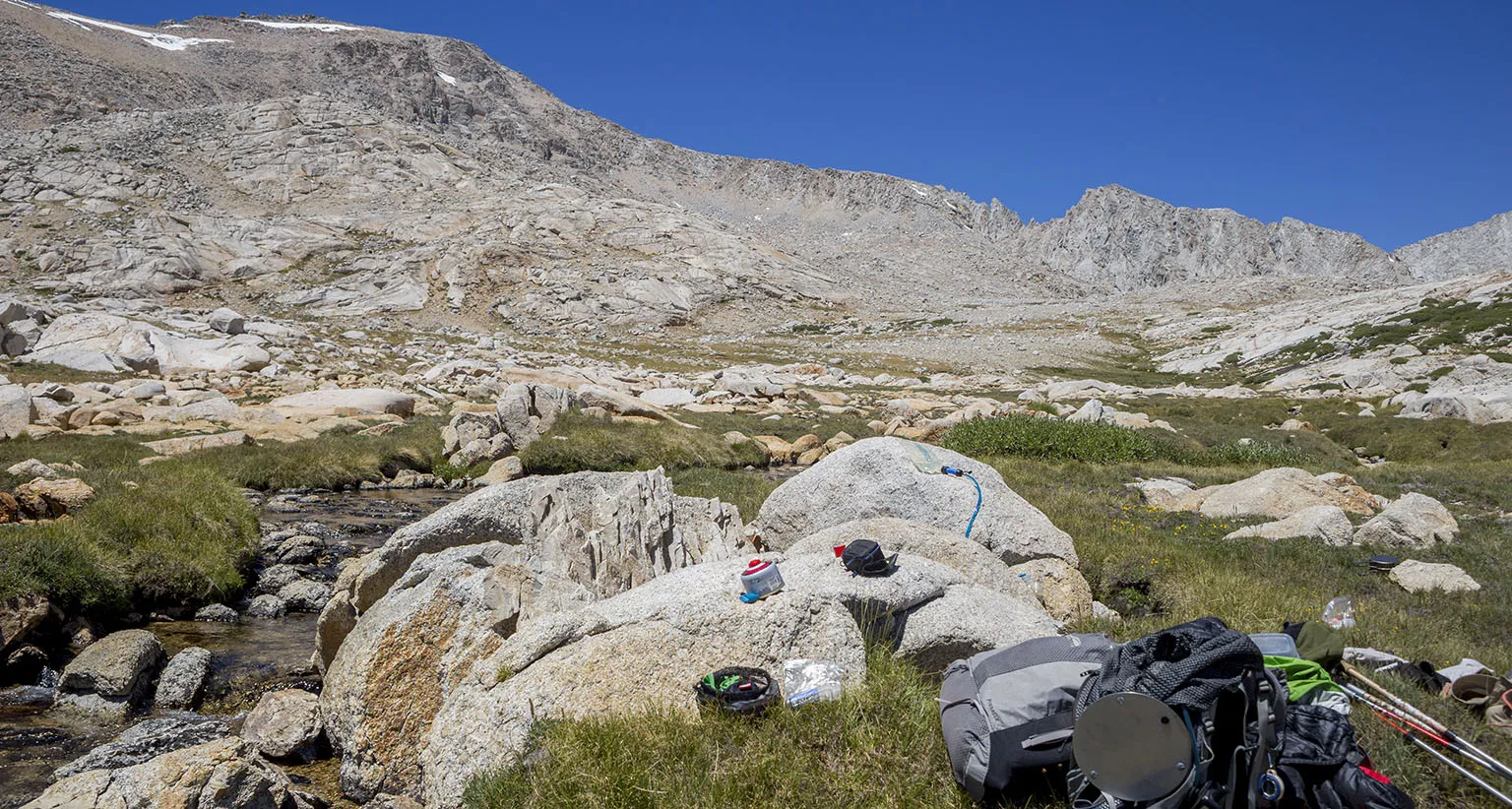 Lunch spot and our messy gear. Forester Pass is the tiny snow spot on the far right in the back