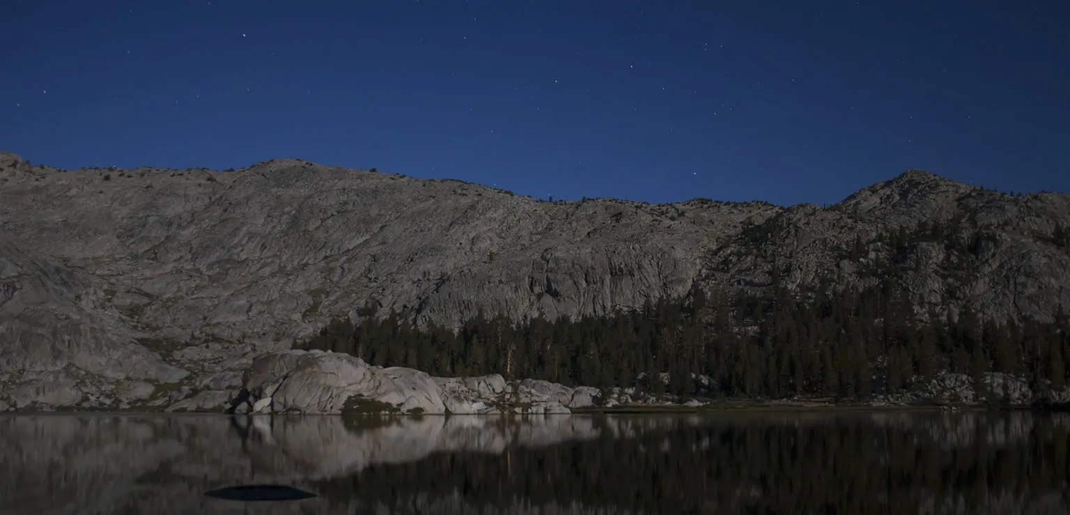 Granite Lake by moonlight - the dark shape in the water is not the back of the Loch Ness monster, it