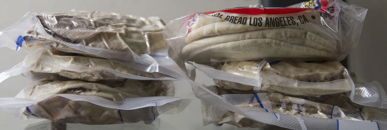 Right top: one bag with 6 normal pita breads. The other five compressed packages contain 48 pitas in total.