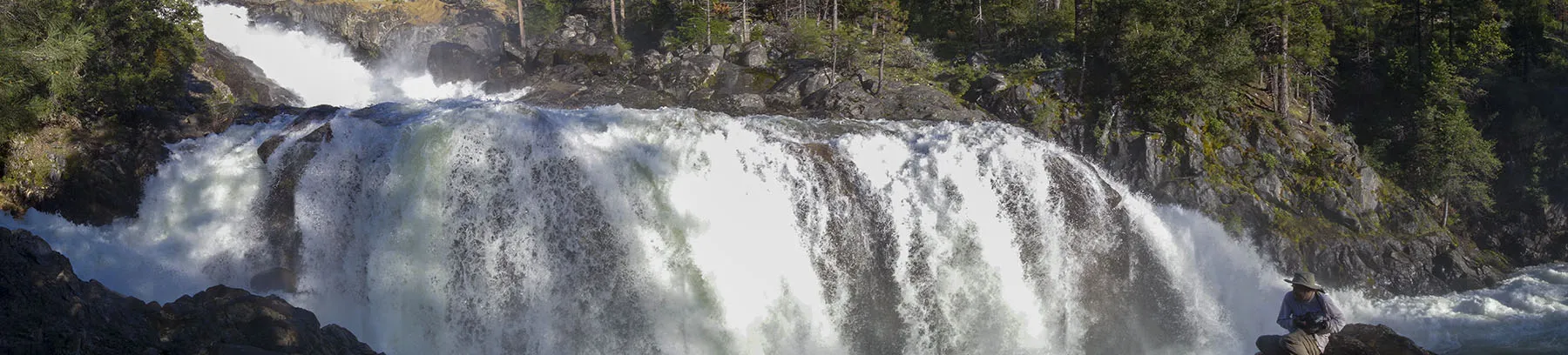 Panorama of Rancheria Falls with your truly in the foreground, trying in vain to shield the camera from the spray